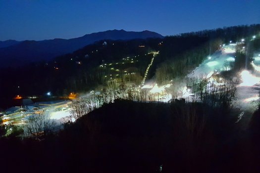 Ober at night near Ever After, a 1 bedroom cabin rental located in Gatlinburg