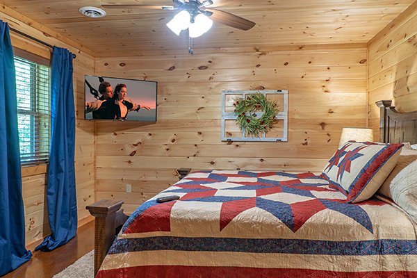 Third bedroom with TV at Relaxation Ridge, a 2 bedroom cabin rental located in Pigeon Forge