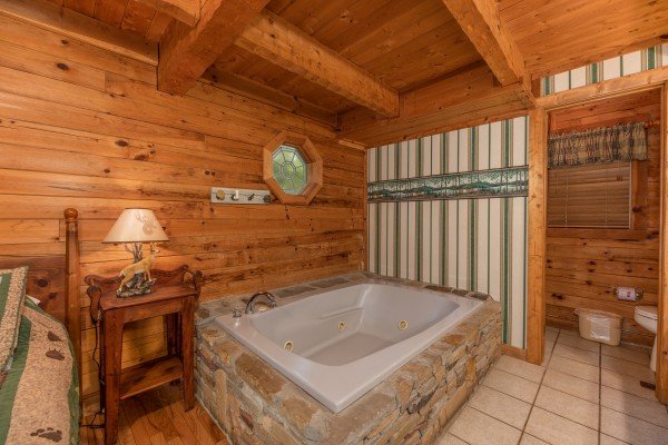 Jacuzzi in a bedroom at Yes, Deer, a 2 bedroom cabin rental located in Pigeon Forge