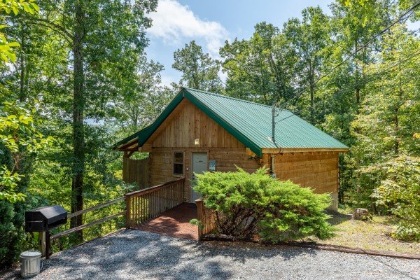 Parking area with grill and cabin entrance at Loving You, a 1 bedroom cabin rental located in Pigeon Forge
