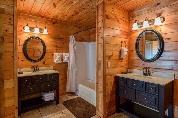 Double vanities in the upstairs bathroom at Rocky Top Lodge, a 3 bedroom cabin rental located in Pigeon Forge
