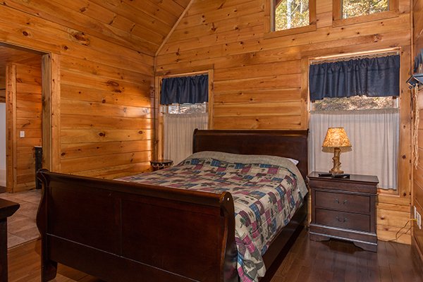 Queen bedroom on the upper floor at Rocky Top Lodge, a 3 bedroom cabin rental located in Pigeon Forge