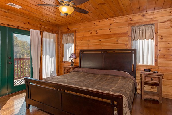 King bedroom with deck access at Rocky Top Lodge, a 3 bedroom cabin rental located in Pigeon Forge