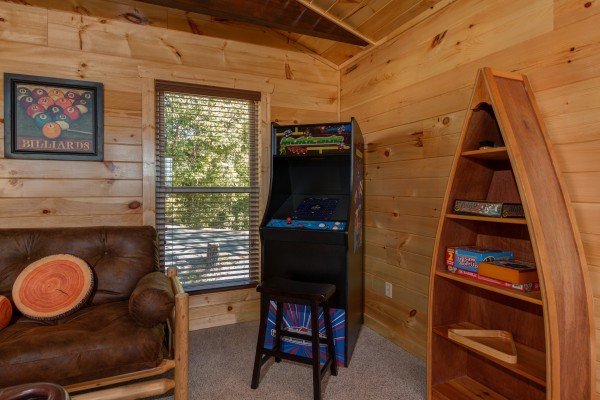 Arcade game at Canyon Camp Falls, a 2 bedroom cabin rental located in Pigeon Forge