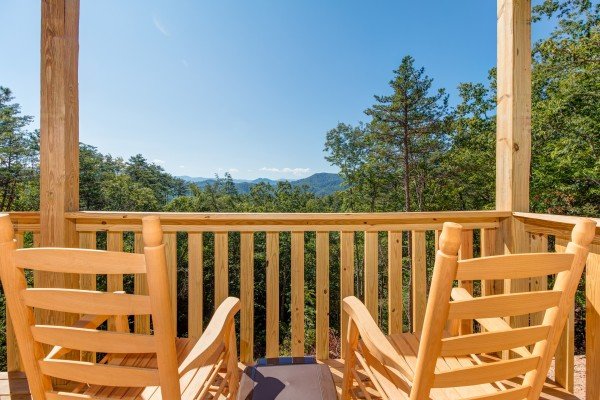 Rocking chairs and a mountain view at Canyon Camp Falls, a 2 bedroom cabin rental located in Pigeon Forge