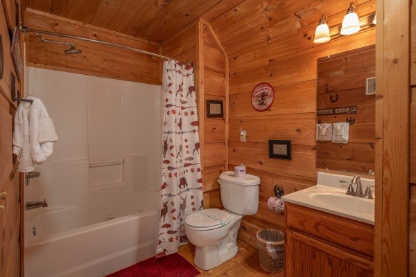 Bathroom with a tub and shower at Logan's Smoky Den, a 2 bedroom cabin rental located in Pigeon Forge 