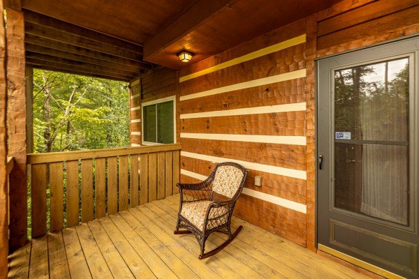 Rocking chair on a deck at Cubs' Crib, a 3 bedroom cabin rental located in Gatlinburg