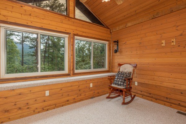 Rocking chair in a large room at Cubs' Crib, a 3 bedroom cabin rental located in Gatlinburg