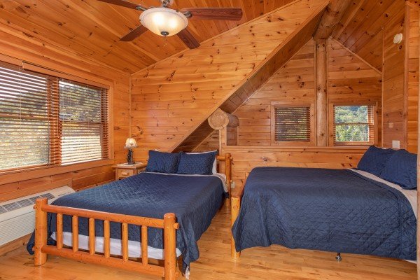 Room with three queen beds and two twin beds at Great View Lodge, a 5-bedroom cabin rental located in Pigeon Forge