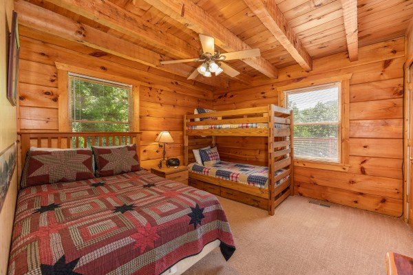 Bedroom with a full bed and twin bunks at Eagle's Loft, a 2 bedroom cabin rental located in Pigeon Forge