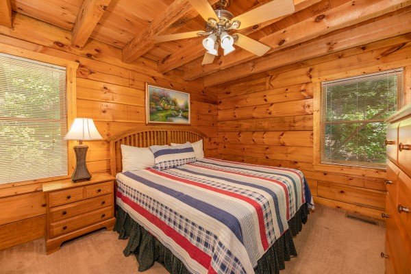 Bedroom with a king bed and nightstand at Eagle's Loft, a 2 bedroom cabin rental located in Pigeon Forge