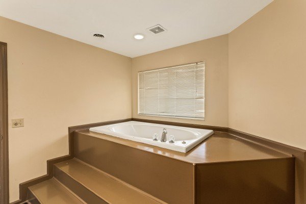 Jacuzzi in a bathroom at Chalet Mignon, an 8-bedroom cabin rental located in Gatlinburg