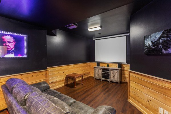 Projector in the theater room at Chalet Mignon, an 8-bedroom cabin rental located in Gatlinburg