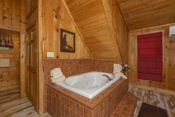 Jacuzzi in a bedroom at A Beary Nice Cabin, a 2 bedroom cabin rental located in Pigeon Forge