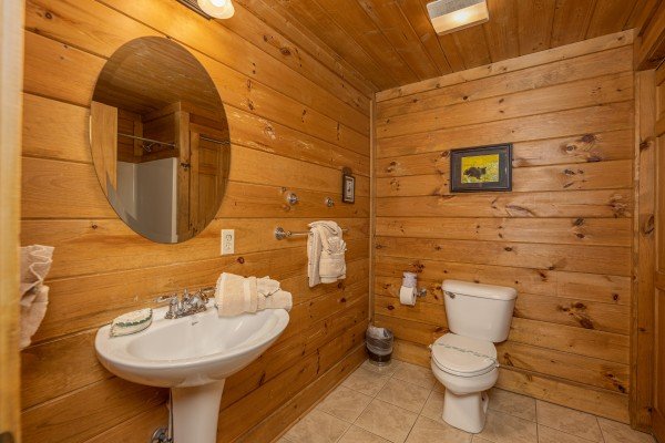 Bathroom with a pedestal sink at A Beary Nice Cabin, a 2 bedroom cabin rental located in Pigeon Forge