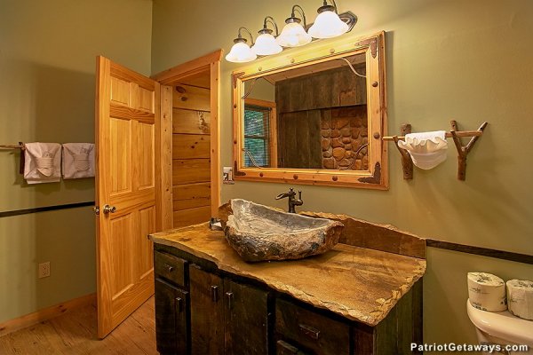 Bathroom with a custom vanity sink at Picture Perfect Hideaway, a 2 bedroom cabin rental located in Pigeon Forge