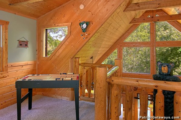 Game table in the loft space at Picture Perfect Hideaway, a 2 bedroom cabin rental located in Pigeon Forge