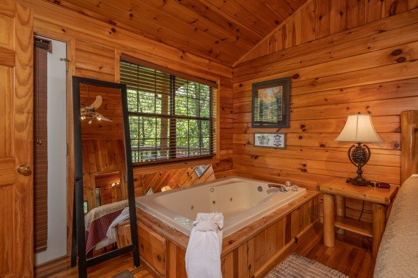 Bedroom jacuzzi tub at Hello Dolly, a 1 bedroom cabin rental located in Pigeon Forge