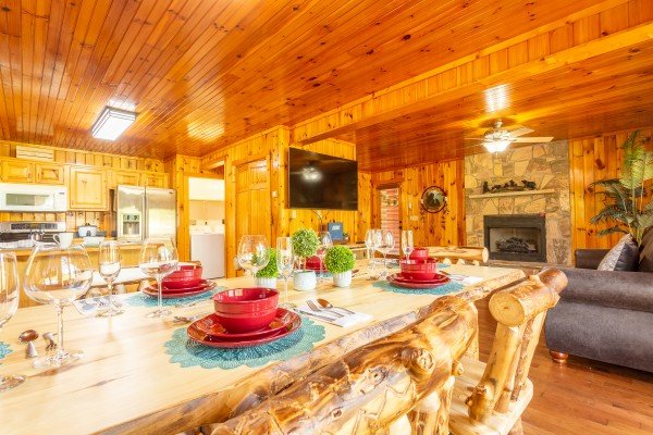 Dining table and kitchen at 1 Crazy Cub, a 4 bedroom cabin rental located in Pigeon Forge