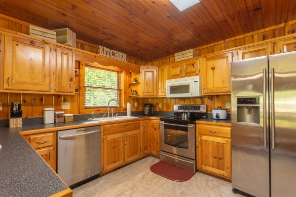 Kitchen with stainless steel appliances at 1 Crazy Cub, a 4 bedroom cabin rental located in Pigeon Forge