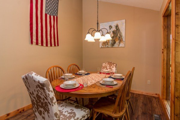 Dining room for six at The Settlement, a 10 bedroom cabin rental located in Pigeon Forge