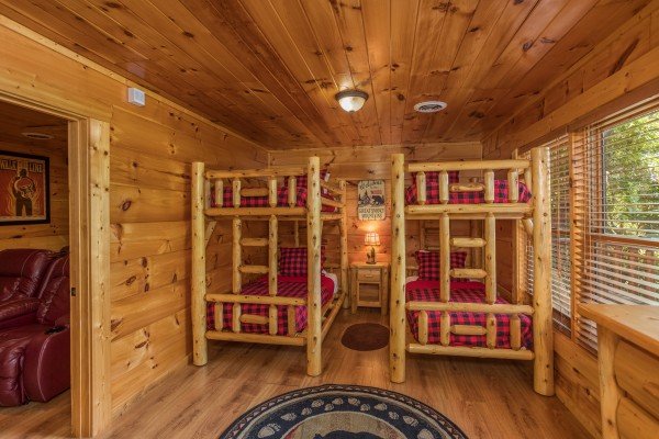 Bedroom with two sets of bunk beds at Graceland, a 4-bedroom cabin rental located in Pigeon Forge