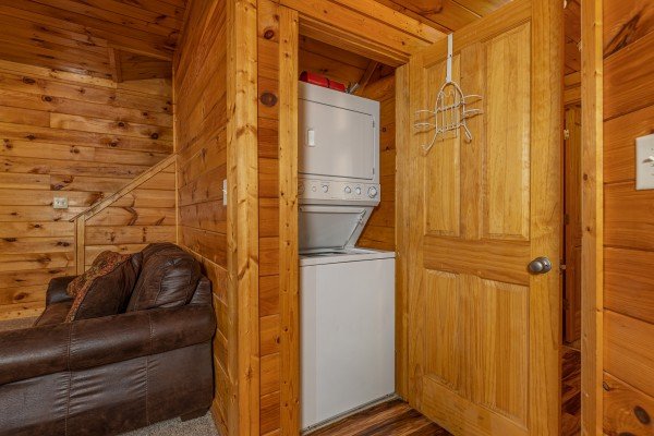 Stacked washer and dryer at Family Getaway, a 4 bedroom cabin rental located in Pigeon Forge