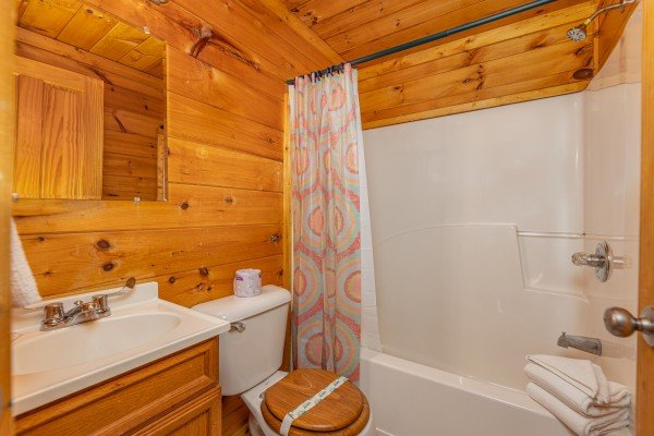 Bathroom with a tub and shower at Family Getaway, a 4 bedroom cabin rental located in Pigeon Forge