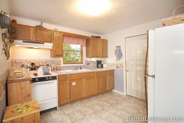 Kitchen at Dolly's Adorable River Cottage, a 3-bedroom cabin rental located in Pigeon Forge