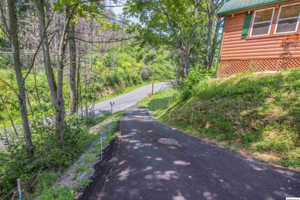 Looking down the driveway at the main road at Mountain Breeze, a 1 bedroom cabin rental located in Pigeon Forge