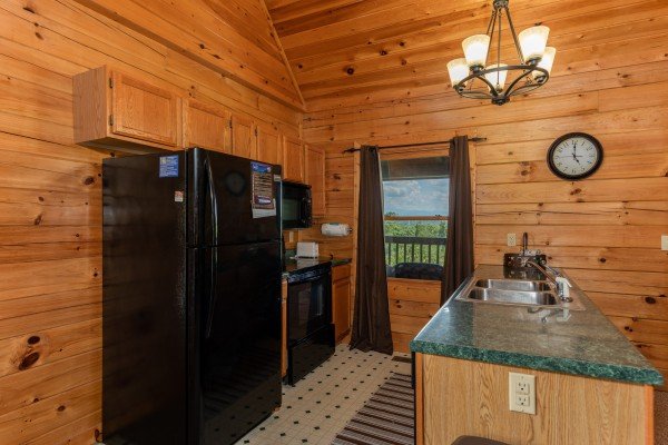 Kitchen with black appliances at Top of the Way, a 2 bedroom cabin rental located in Pigeon Forge