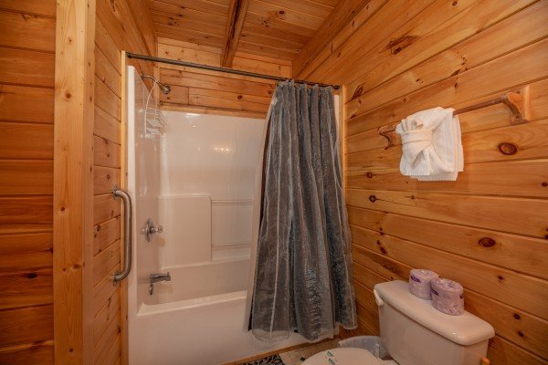 Bathroom with a tub and shower at Top of the Way, a 2 bedroom cabin rental located in Pigeon Forge