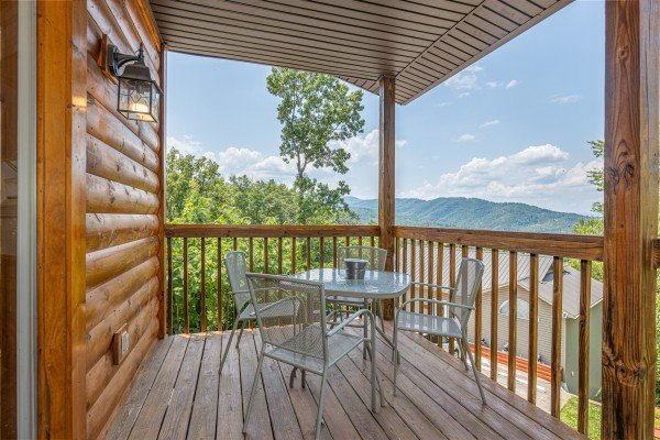 Deck table and chairs at High In The Smokies, a 2 bedroom cabin rental located in Gatlinburg