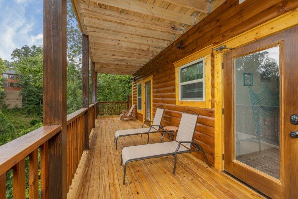 Chaise lounge chairs on a deck at Alpine Adventure, a 4 bedroom cabin rental located in Pigeon Forge