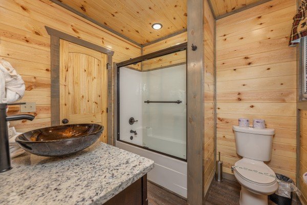 Bathroom with a tub and shower at Alpine Adventure, a 4 bedroom cabin rental located in Pigeon Forge