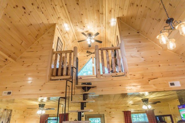 Ladder leading to the loft space at Pigeon Forge Treehouse, a 1 bedroom cabin rental located in Pigeon Forge