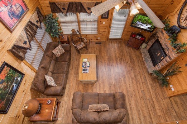Looking down at the living room at 5 Star Celebration, a 1 bedroom cabin rental located in Pigeon Forge
