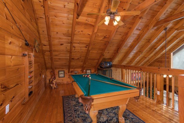 Pool table in the loft at 5 Star Celebration, a 1 bedroom cabin rental located in Pigeon Forge