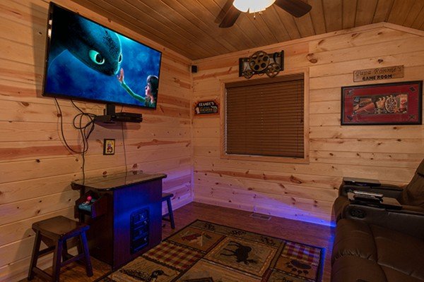 Theater room screen at Without A Paddle, a 3 bedroom cabin rental located in Gatlinburg
