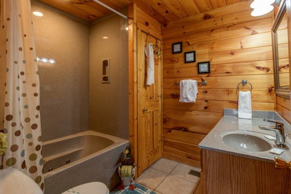 Bathroom with a jacuzzi tub at Hummingbird's Views, a 1 bedroom cabin rental located in Pigeon Forge