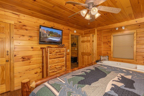 Dresser and TV in a bedroom at Moonlit Pines, a 2 bedroom cabin rental located in Pigeon Forge