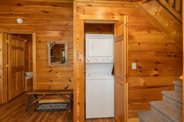 Stacked washer and dryer at Moonlit Pines, a 2 bedroom cabin rental located in Pigeon Forge