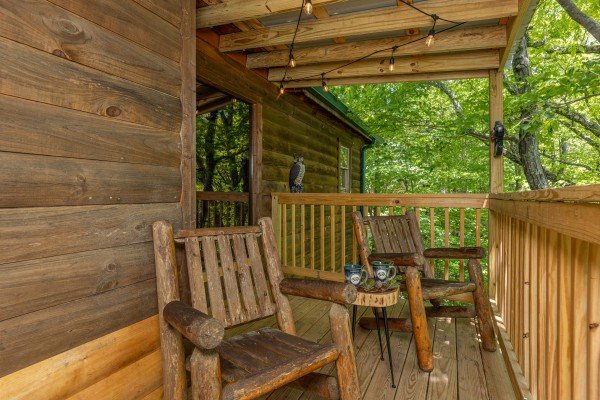 Chairs on the lower deck at Moonlit Pines, a 2 bedroom cabin rental located in Pigeon Forge