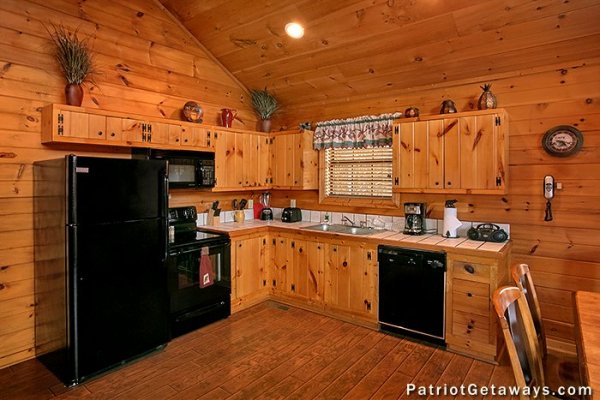 Kitchen at a getaway with A Getaway with a View, a 2 bedroom cabin rental located in Pigeon Forge
