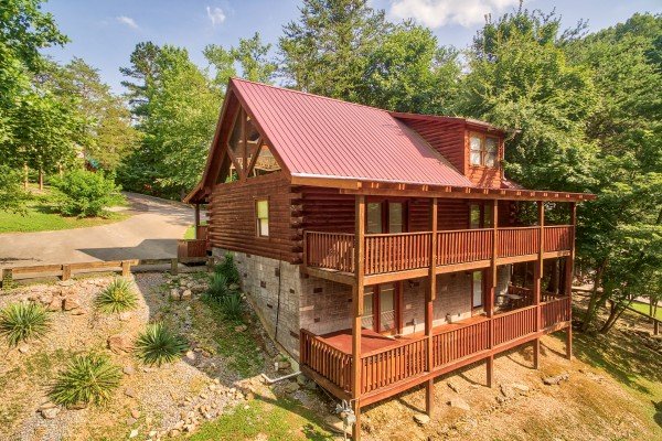 exterior view of the two levels of decks on the back of alpine tranquility a 4 bedroom cabin rental located in pigeon forge