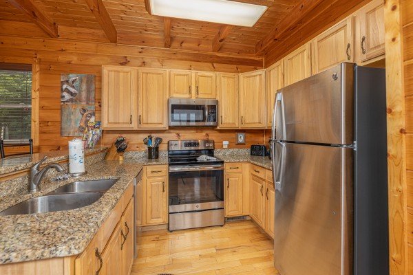 Kitchen with stainless appliances at 1 Awesome View, a 3 bedroom cabin rental located in Pigeon Forge