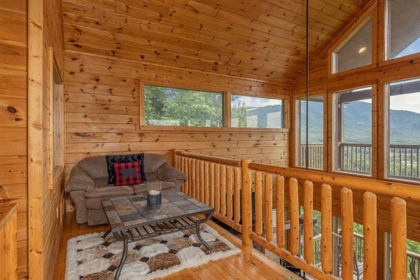 Loft with sleeper sofa at 1 Awesome View, a 3 bedroom cabin rental located in Pigeon Forge