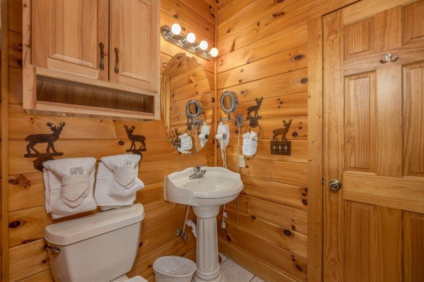 Bathroom with a pedestal sink at 1 Awesome View, a 3 bedroom cabin rental located in Pigeon Forge