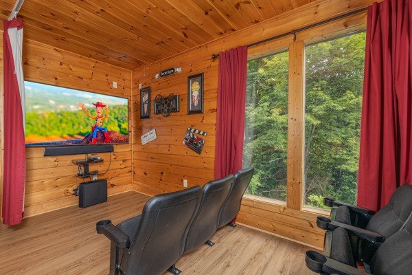 Home theater with theater seats at 1 Awesome View, a 3 bedroom cabin rental located in Pigeon Forge