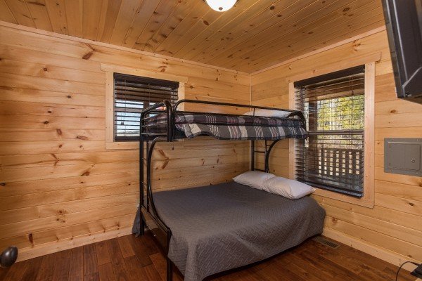 Room with full-sized bunk with a twin bunk off the kitchen at Gonzo's Outpost, a 3-bedroom cabin rental located in Pigeon Forge